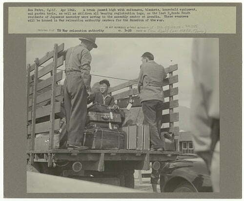San Pedro, Calif. Apr. 1942. A truck jammed high with suitcases, blankets, household equipment, and 