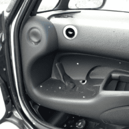 How do you remove the door panel on a 2007 Mini Cooper?