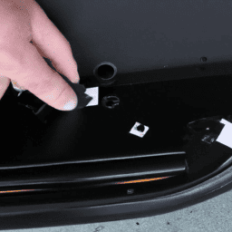 How do you remove the door trim on a 2006 Mini Cooper?