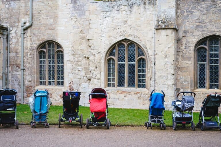 can a sstroller fit in a mini cooper?, even assorted-colored strollers near building
